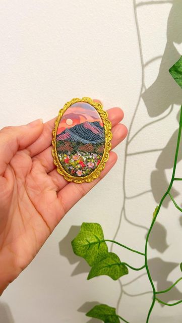 VINA adore life on Instagram: "Spilling the tea on how I make my signature Gold Frames!! 🫢🪞🖼️🌷✨ This is part 2 of this Sunset Mountain design! Watch part 1 to see the creation process happen! 🥰 Follow for more Clay Painting & updates on when these pieces are LIVE in the shop!! 😁🌷🧚🏽‍♀️✨ @vina.shop.uk - - - - - - - - - - - - - #polymerclaypainting #polymerclayjewelry #polymerclaycreations #polymerclayart #fairycore #cottagecore #mushroomcore #magicalartwork #fairyfashion #goldframes #artp Framed Polymer Clay Art, Polymer Clay Mountains, Painting With Polymer Clay, Polymer Clay Frame, Mythical Accessories, Clay Landscape, Mushroom Core, Clay Painting, Polymer Clay Painting