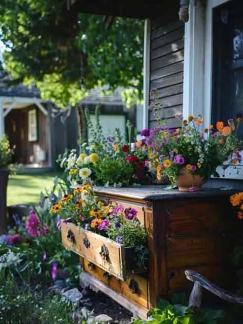 22 Creative Upcycled Flower Bed Ideas to Refresh Your Garden Old Dresser Garden Ideas, Front Porch Dresser Ideas, Garden Dresser Planter, Suitcase Planter Ideas, Dresser On Porch Ideas, Dresser On Front Porch Decor, Small Garden Flower Bed Ideas, Garden Barrels Ideas, Small Deck Garden Ideas