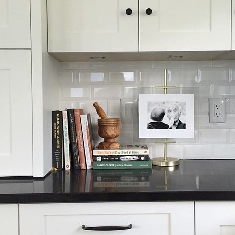 One way to display cookbooks!! When your toaster and coffeemaker is hidden away you can install an easel with grandpa and @crystalhasell oldest son  #whitekitchencabinets #blackquartzcountertops Kitchen Cookbook Display, Display Cookbooks, Cookbook Display, Counter Top Decor, Cookbook Storage, Iron Station, Maria Killam, Kitchen Buffet, Kitchen Counter Decor