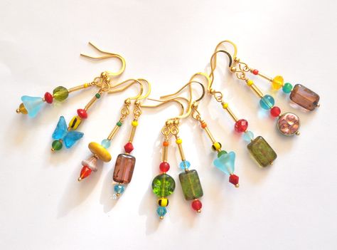 Ready to add a burst of joy to your accessory collection?  Introducing our mismatched colorful earrings, a delightful mix of glass, wood, and coral beads!  Each pair is a whimsical masterpiece, designed to bring out your quirky side. Crafted with 18K gold-plated stainless steel hooks, these earrings are not only stunning but also nickel-, cadmium-, and lead-free--perfect for sensitive ears.  Measuring approximately 36mm (1.4") from the lower part of the hook, they dangle with charm and personali Mix Match Earrings, Earrings Summer, Earrings Trendy, Earrings Colorful, Summer Earrings, Mismatched Earrings, Summer Earring, Colorful Earrings, Trendy Earrings