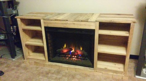 To let feel the warm and cozy in your media room we have brought this distinguished design of DIY pallet media cabinet with inside fireplace setup inside to Fireplace Tv Stand Diy, Pallet Furniture Tv Stand, Pallet Fireplace, Tv Console With Fireplace, Pallet Entertainment Centers, Build A Tv Stand, Weekend Home Projects, Tv Stand With Fireplace, Diy Entertainment