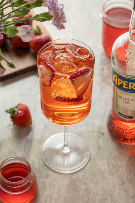 Strawberry Aperol Spritz - The Boozy Ginger Strawberry Aperol Spritz, Aperol Spritz Variation, Strawberry Syrup Recipe, Sparkling Cocktails, Cocktail Inspiration, Sparkling Cocktail, Strawberry Syrup, Summer Cocktail Recipes, Food Photography Inspiration