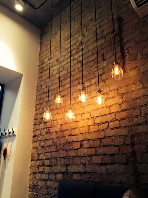 Brick Wall Lighting, White Brick Wall Interior, Brick Interior Design, Industrial Spotlight, Brick Cafe, Scrabble Wall, Brick Interior, Man Cave Office, Backyard Buildings