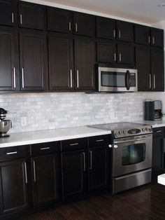 White Subway Tile Backsplash. Birch Kitchen Cabinets, Dark Brown Kitchen Cabinets, White Marble Backsplash, Backsplash With Dark Cabinets, Trendy Kitchen Backsplash, Dark Brown Cabinets, Brown Kitchen Cabinets, Kabinet Dapur, Herringbone Backsplash