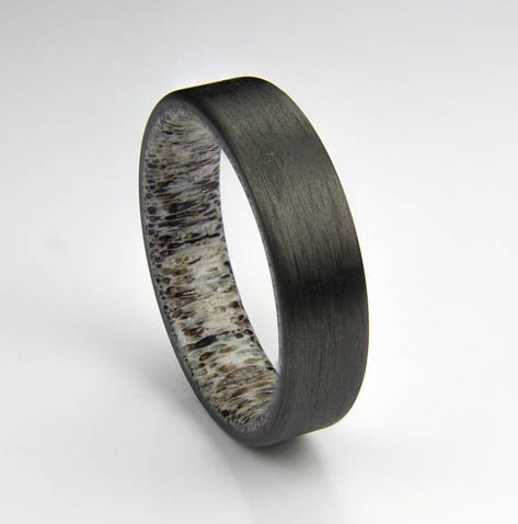 This Carbon fiber ring is handcrafted from real Carbon fiber and Elk antler. Rings shown are approx. 6 mm wide & Size 10 The ring is presented in Cherry Rosewood wood ring box. PLEASE NOTES: (1)Elk antler shade and color varies from piece to piece. Your ring may not look exactly like Elk Antler Wedding Band, Engagement Rings Black, Antler Rings, Carbon Fiber Ring, Antler Wedding Band, Carbon Fiber Rings, Elk Antler, How To Wear Rings, Wood Ring Box