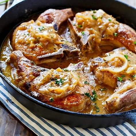 Smothered Pork Chops- Thick cut bone-in pork chops are covered in an easy onion gravy with just a touch of creaminess from some buttermilk. Southern Pork Chops, Chicken Fried Steak Easy, Ribs Recipes, Pork Dinners, Spicy Southern Kitchen, Pork Entrees, Smothered Pork, Pork Chop Dinner, Smothered Pork Chops