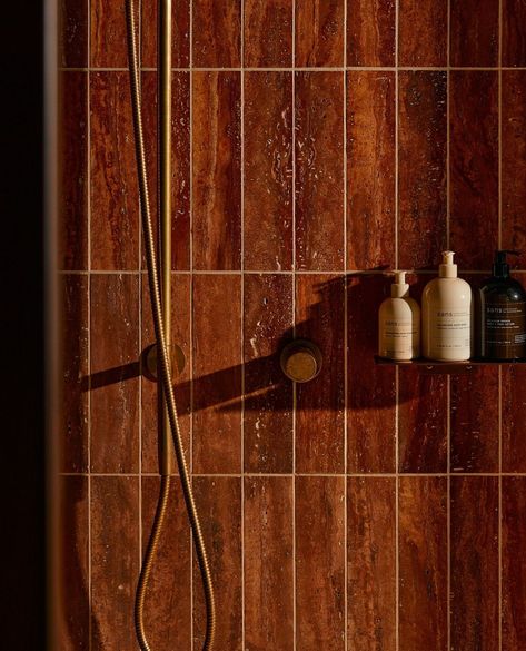 Relax and unwind at @sos.senseofself and check out the wonderful red travertine walled showers. 📸by: @annikakafcaloudis Rust Shower Tile, Bathhouse Interior Design, Rust Bathroom Tiles, Red Clay Aesthetic, Brick Red Bathroom, Red Travertine Bathroom, Rust Tile Bathroom, Earthy Shower Tile, Maroon Tile Bathroom