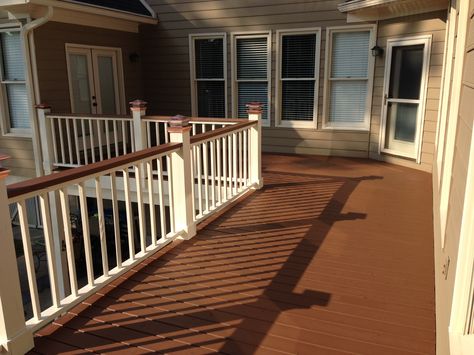 Two tone deck, copper solar lights, solid stain, painted deck rails, chocolate stain. Hadn't considered tan/copper but might look good with our brick colors. Food for thought. Deck Paint Ideas, Two Tone Deck, Deck Paint Colors, Painted Deck, Deck Rails, Deck Stain Colors, Deck Railing Design, Solid Stain, Southern Porches