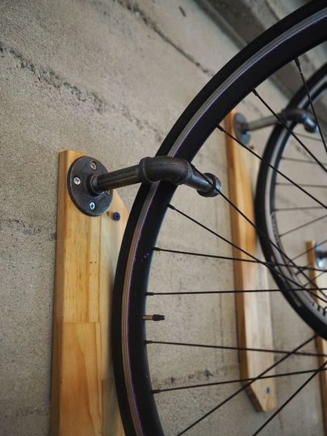 Weekend Project: Make a DIY Reclaimed Wood Wall Bike Hanger | Man Made DIY | Crafts for Men | Keywords: bike, storage, pipe, organization Diy Reclaimed Wood Wall, Rack Velo, Bike Rack Garage, Casa Garage, Bike Storage Garage, Bike Rack Wall, Range Velo, Bike Hanger, Support Velo