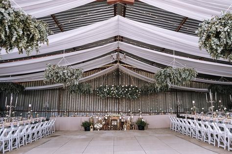 Hangar Wedding Decor, Metal Shop Wedding Reception, Boho Wedding Ceiling Decor, Machine Shed Wedding Reception, Machine Shed Wedding, Airport Hanger Wedding, Pole Barn Wedding, Wedding Plants Decor, Influencer Dinner