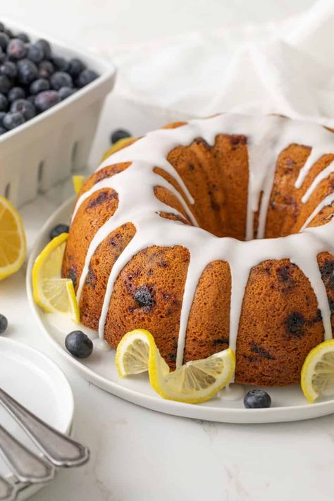 This moist and delicious Blueberry Lemon Bundt Cake is bursting with fresh, vibrant flavors of tangy lemon and sweet juicy blueberries in every bite. No one will ever know it starts with a boxed cake mix! Blueberry Bundt Cake Recipes, Lemon Blueberry Bundt, Lemon Blueberry Bundt Cake, Blueberry Bundt, 7up Pound Cake, Blueberry Bundt Cake, Restless Chipotle, Buttermilk Pound Cake, Lemon Bundt Cake