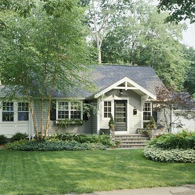 Cottage Facelift Cottage Facelift Sliding the front entrance toward the center of this home and bumping it out helps balance out the structure and gives it more depth. Wide stone steps and a cross gable clearly mark off the entryway and graciously invite guests inside. Replacing large bushes with lower ground coverings complements the home's proportions instead of overpowering them. The addition of even these small details adds architectural interest to the small home. Curb Appeal Porch, Front Porch Addition, Porch Stairs, Entry Porch, Ranch Remodel, Porch Addition, Porch Roof, Home Exterior Makeover, Exterior Makeover