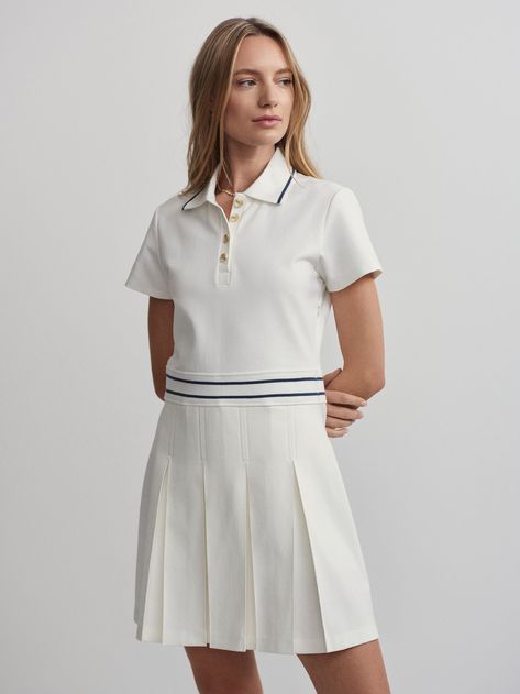 Made from a durable and structured fabric, this dress features a fitted, short sleeve top and button neck, with a pleated A-line skirt. Wear with a pair of your favorite Varley shorts underneath for additional coverage and support. Varley Leggings, Golf Dress, Snow Dress, Box Pleat Skirt, Sporty Dress, Golf Dresses, Tennis Fashion, Fashion White, Activewear Brands