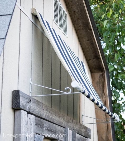 do it yourself fabric awning!  how cute and easy! must buy something that repels water for the patio slider! Shed Awning Ideas, Diy Awning, House Awnings, Fabric Awning, Outdoor Awnings, Door Awnings, Window Awnings, Outdoor Sheds, Diy Shed