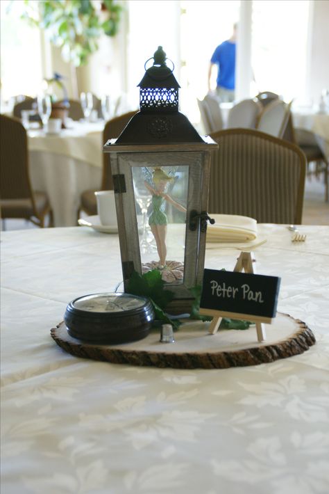 PETER PAN CENTERPIECE: Bought the lantern, and wooden base at an Arts & Crafts store. Bought the time watch and thimble at a thrift store. Put a Tinkerbell into the lantern and there you go! A trapped Tinkerbell! Peter Pan Wedding, Disney Wedding Ideas, Disney Centerpieces, Disney Wedding Centerpieces, Disney Bridal Showers, Tema Disney, Disney Wedding Theme, Disney Party, Disney Theme