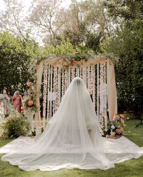 Glances between the flower wall and beautiful ceremony moments 🥀⁠ ⁠ Photography: @ngcreativestudio⁠ Venue: @burnhamgroveestate⁠ Decor: @nokshaevents⁠ Bouquet: @springfull_⁠ Makeup: @mariamzafarbridal⁠ Bridal Outfit: @abhishekh_n_radhika⁠ Wedding Rings: @austenandblake⁠ Bridal Jewellery: @sgjewelz⁠ Nikkah Certificate: @calligraphybyaiman