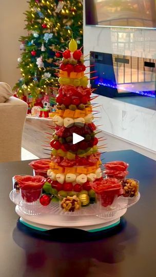 1.1K views · 6.7K reactions | My first Charcuterie Xmas Tree 🌲🩷🎉🧑‍🎄 
Creating a charcuterie Christmas tree is a delightful way to incorporate festive spirit into the food presentation. It is easy to do but it takes time though. 

What you will need:
-styrofoam cone 
- Syringe wrap
- lots of toothpicks
- charcuterie of choice
- Salami for the board flowers decoration
- Trail mix for board decoration

Remember to be creative and have fun with the arrangement, adjusting ingredients as needed to suit your taste preferences and the size of your serving board! 🥰🥰🥰

MERRY CHRISTMAS 🎄🎁🧑‍🎄🦋💕

🩷🩷🩷🩷🩷

#christmascharcuterie #xmasdiy
#christmasdecor #xmas2023 #aestheticchristmas #charcuterietree #christmasfood #appetizers #charcuterieboard #holidaypartyideas #christmaspartyideas #che Charcuterie Tree Cone, Charcuterie Christmas Tree, Charcuterie Christmas, Christmas Foods, Flowers Decoration, Fruit Dip, Board Decoration, Xmas Diy, Trail Mix