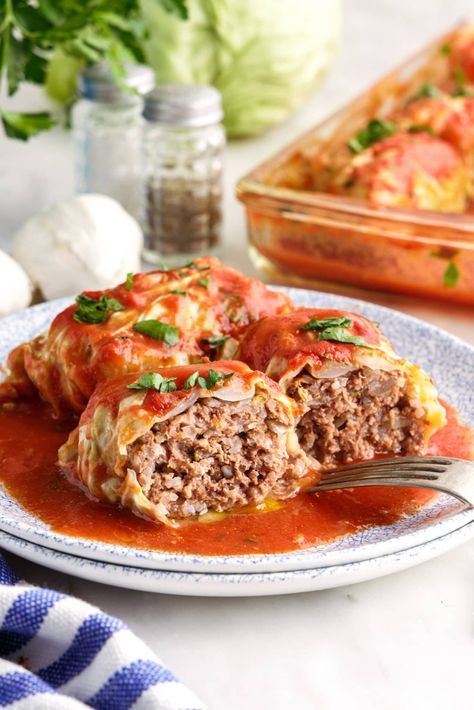 Ground beef, Italian sausage, long grain rice, and plenty of flavorful seasonings are stuffed inside tender cabbage leaves then doused in tomato sauce in this cabbage roll recipe. Slow Cooker Cabbage Rolls, Stuffed Cabbage Rolls, Cabbage Roll, Cabbage Rolls Recipe, Stuffed Cabbage, Mince Recipes, Hot Italian Sausage, Homemade Tomato Sauce, Comfort Dishes