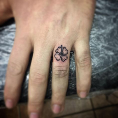 Four Leaf Clover Tattoo | Tattoo Ideas and Inspiration Clover Finger Tattoo, Clover Hand Tattoo, Four Leaf Clover Tattoo Traditional, Four Leaf Clover Finger Tattoo, Shamrock Finger Tattoo, Four Leaf Clover Tattoo For Men, 4 Leaf Clover Tattoo Men, Four Leaf Clover Tattoo Design, 4 Leaf Clover Tattoo