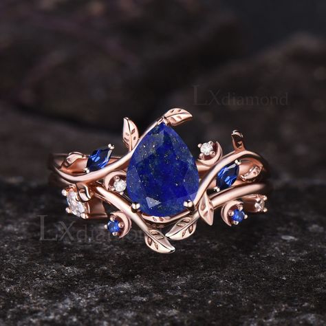 Item description ✦ Handmade item! ✦ Material: 925 sterling silver, Solid 10k/14K/18K GOLD (can be made in white/rose/yellow gold) Engagement ring ✦ Center stone: Natural Lapis Lazuli ✦ Size/Weight: 6x8mm Pear Cut ✦ Side stones: Marquise Cut Lab Blue Sapphire and Round Cut Moissanites Wedding band ✦ Gemstones: Lab Blue Sapphire and Moissanites Any ring size can be made,if the ring size is not in the option list ,contact me. As it is handmade,it needs 2-4 weeks to finish and then be shipped by usp Gold Rings With Blue Stones, Lapis Lazuli Engagement Ring, Sapphire Wedding Ring Set, Ring Blue Sapphire, Unique Engagement Ring Settings, Cute Engagement Rings, Nature Inspired Rings, Yellow Engagement Rings, Blue Sapphire Ring