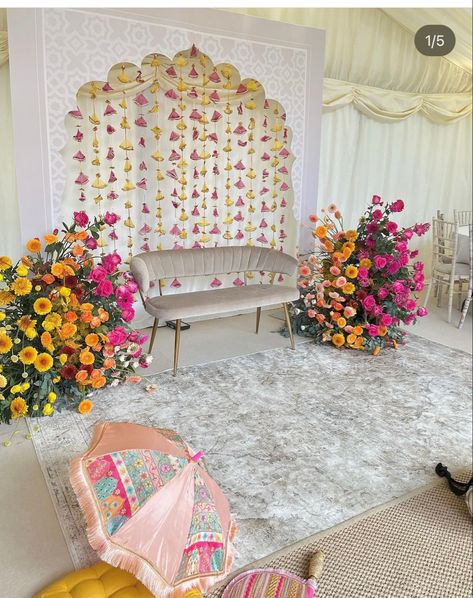 Mendi Stage Decor, Pink And Yellow Mehndi Decor, Pink And Yellow Indian Wedding Decorations, Decor For Roka Ceremony, Home Mendhi Decor, Hurdee Night Decor, Mendhi Backdrop Mehndi Decor, Jago Decor Backdrop, Indian Wedding Backdrops