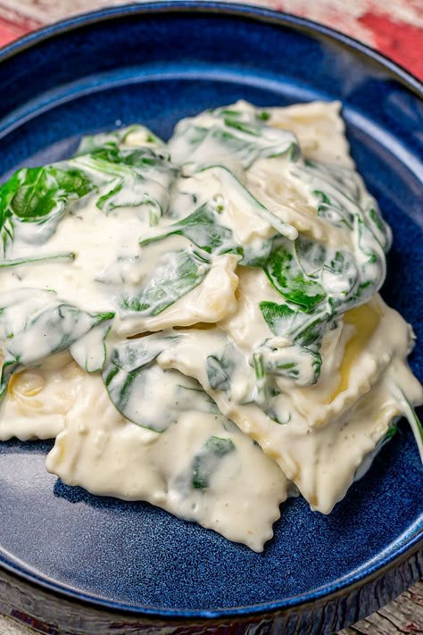 Delight in the simple elegance of Spinach and Cheese Ravioli in a Creamy Sauce. A recipe that marries convenience with gourmet flavors for times when you're looking for something creamy and delicious. This dish offers a quick, satisfying meal featuring tender ravioli, fresh spinach, rich cheese, and a luxuriously creamy sauce. Microwave Chicken Recipes, Vegan Italian Pasta, Ravioli Sauce Recipe, Cheese Ravioli Recipe, Spinach And Cheese Ravioli, Spinach Casserole Recipes, Ham Breakfast Casserole, Pressure Cooker Recipes Chicken, Italian Sauces