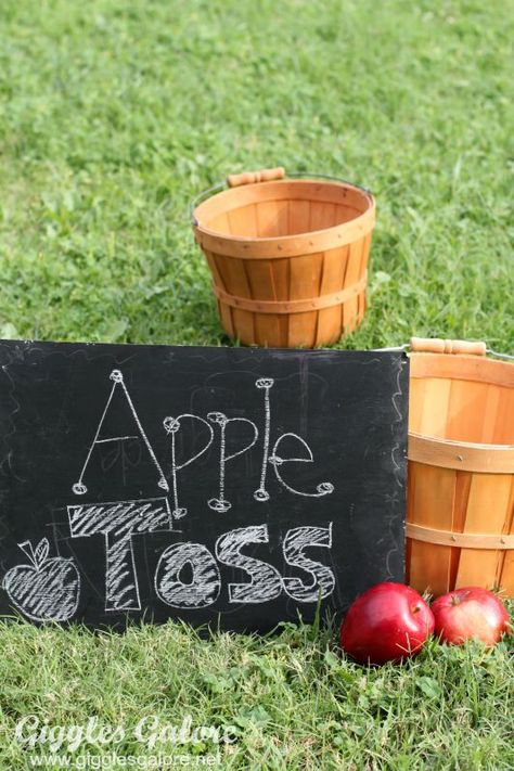 Apple Toss Game Fall Apple Festival Ideas, Fall Festival Birthday Party Ideas, Harvest Party Preschool, Apple Toss Game, Outdoor Fall Party Games, Fall Festival For Church, Fall Festival Table Decorations, Apple Festival Ideas, Fall Yard Games