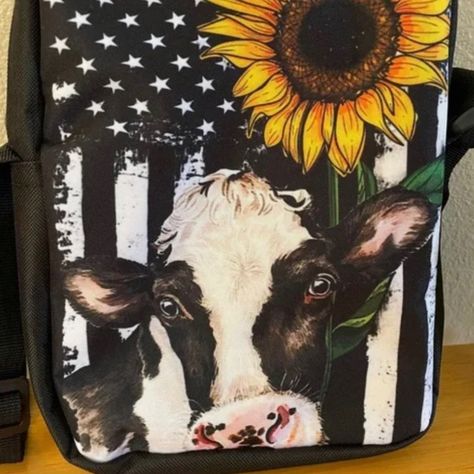 An Adorable Purse Especially If You Love Cows! A Sweet Cow Face With A Sunflower In The Top Corner All Set In Front Of A Black And White Us Flag. (Soda Is For Size Reference). There Is An Open Pocket Inside The Main Interior Which Can Hold Essentials Such As Pens, Lipsticks, Sanitizer Etc, And Even Your Phone! On The Backside Is A Zippered Pouch Which I Think Is A Great Place To Put Your Phone And Car Keys For Easy Access When Running Into The Store. Both Pockets Are Roomy. The Main Interior Is Cow And Sunflower, Sunflower Black And White, Sweet Cow, Cow Face, Zippered Pouch, Cat Friendly Home, Us Flag, Car Keys, Lipsticks