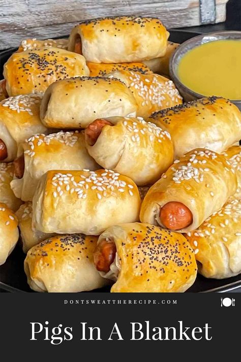 This classic pigs in a blanket recipe is a perfect appetizer for any party, tailgate, gathering, or weeknight! The tasty bite-size treat. Pigs In A Blanket Using Canned Biscuits, Recipe Using Biscuits, Recipe Using Canned Biscuits, Pigs In A Blanket Recipe, Breakfast Sausage Links, Fantasy Draft, Pillsbury Dough, Cocktail Sausages, Canned Biscuits