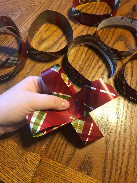 Bows For Presents How To Make, Making Bows Out Of Wrapping Paper, Making A Bow Out Of Wrapping Paper, How To Make A Bow From Wrapping Paper, Wrapping Paper Bow Easy, Bows From Wrapping Paper, Diy Paper Bows For Presents, How To Make Paper Bows, Diy Bow From Wrapping Paper