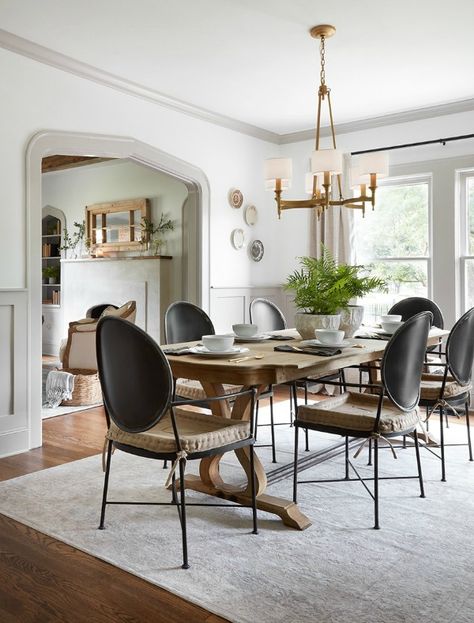 Dining room with modern Louis black chairs and farm table.  Come get inspired by Tranquil and Timeless Tudor Design Details From a Serene 1920s Texas Cottage renovated on HGTV's Fixer Upper by Chip and Joanna and known as the Scrivano House. Joanna Gaines Living Room, Fixer Upper Dining Room, Fixer Upper Living Room, Fixer Upper Decor, Fixer Upper House, Interior Simple, Farmhouse Style Bedrooms, House Dining Room, Rooms Ideas