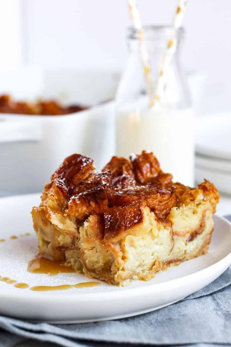 Slice of croissant bread pudding on a white plate drizzled with a vanilla sauce. Bread Pudding With Croissants, Croissant Bread Pudding, Croissant Bread, Homemade Croissants, Sourdough Recipe, Pecan Pies, Bread Puddings, Seasonal Desserts, Vanilla Sauce