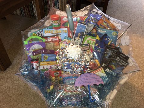 This is an auction item I made for a Mary Poppins themed fundraiser. It is a child’s umbrella full of rainy day activities for children including science kits, slime kit, popcorn and a movie, coloring and activity books, arts and crafts, clay with tools, games, and more. It went for $75. Rainy Day Raffle Basket, Rainy Day Basket Auction, Rainy Day Auction Basket Ideas, Rainy Day Gift Basket Ideas, Rainy Day Basket, Gift Basket Ideas For Adults, School Auction Baskets, Long Basket, Basket Raffle