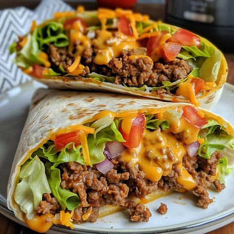 🌮🥩 Wrap up your cravings with this cheesy sensation! #NachoCheeseWrap #BeefyBites 🍽️ Nacho Cheese Beef Wrap 🛒 Ingredients: 1 lb ground beef 1 packet taco seasoning 1 cup nacho cheese sauce 1 cup shredded lettuce 1 cup diced tomatoes 1 cup shredded cheddar 4 large tortillas 👩‍🍳 Instructions: Cook Beef: In a skillet, cook ground beef with taco seasoning until browned. Assemble Wraps: Spread nacho cheese sauce on tortillas. Add beef, lettuce, tomatoes, and cheddar. Wrap & Serve: Fold tortill... Breakfast With Ground Beef, Nacho Cheese Beef Wrap, Folded Wraps, Cheesy Foods, Food Cravings Healthy, Cooking Soul Food, Beef Wraps, Nacho Cheese Sauce, Beef Taco