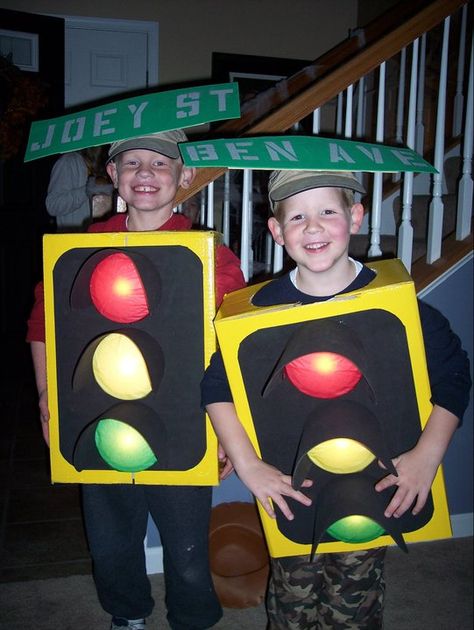 These our our homemade traffic light Halloween costumes. The lights actually lit up and everyone thought that they were great! Stop Sign Halloween Costume, Traffic Sign Costume, Diy Stop Light Costume, Halloween Costumes Traffic Cone, Traffic Light Character, Cars Halloween Costume, Yellow Traffic Light, Vocabulary Parade, Fancy Dress Competition