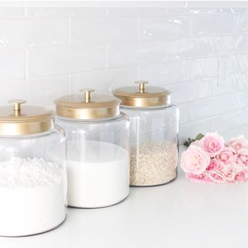 Quick and easy DIY project! Here's a little hack to get these beautiful gold lidded glass kitchen canisters. Also sharing other canisters I love! Kitchen Counter Canister Ideas, Glass Canisters In Kitchen, Kitchen Canisters On Counter Display, Glass Kitchen Canisters, Apple Kitchen Decor, Black Kitchen Decor, Coin Café, Kitchen Accessories Storage, Diy Gold