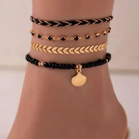 Fashionable 4 Piece Black Gold Toned Anklet Set. The First Anklet Is A Black Rope With Gold Toned Ball Chain Intwined Throughout. The Second Anklet Is A Gold Toned Textured Chevron Design. The Third Anklet Is A Gold Toned Anklet With Black Crystals. The Fourth Anklet Is A Black Beaded Anklet With A Gold Toned Dangle Seashell. Wear Them Together Or Separately To Change Your Look. The Rope Anklet Is Approx. 8.5” With A 2” Extension The Chevron Anklet Is Approx. 8.5” With A 2” Extension The Crystal Anklets Aesthetic, Layered Anklets, Rope Anklet, Black Anklet, Accessories Beads, Crystal Anklet, Adinkra Symbols, Beaded Anklet, Ankle Jewelry