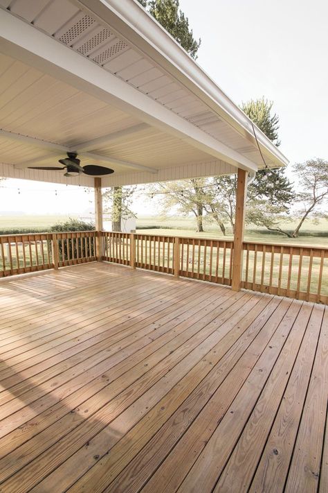 Interior decorator and home blogger Liz Fourez shares everything you need to know about staining a deck from prep to finish! Wood Back Porch Decks, Big Deck Ideas Backyards, Stained Back Porch, Exterior Ideas For House, Stained Deck Ideas, Farmhouse Deck Ideas, Mobile Home Decks And Porches, Back Deck Ideas, Deck Stain Ideas