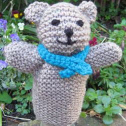 Use this free knitting pattern to knit a toy for knit-a-square Teddy Bear Puppet, Knitted Hand Puppets Free Pattern, Flat Knitted Toys Free Patterns, Toys To Knit, Knitted Bear Pattern, Lonely Child, Bear Puppet, Teddy Bear Knitting Pattern, Glove Puppets