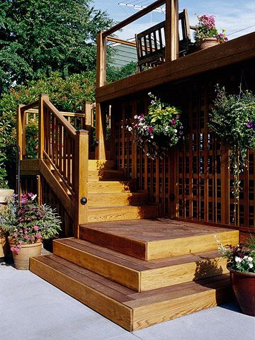 Decorative lattice to hide under the deck along with hanging plants Raised Ranch Deck Ideas, Lattice Alternative, Platform Steps, Deck Skirting, Deck Steps, Ideas For Garden, Deck Stairs, Garden Steps, Outdoor Stairs