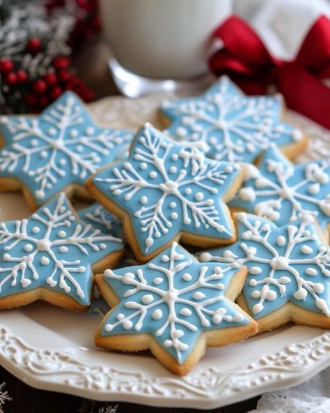 ❄️ Snowflake Cookies ❄️ Beautifully Iced Snowflake Sugar Cookies for the Winter Season Ingredients: 1 cup unsalted butter, softened 1 cup granulated sugar 1 large egg 1 tsp vanilla extract 1/2 tsp almond extract 3 cups all-purpose flour 1/2 tsp baking powder 1/4 tsp salt Royal Icing: 3 cups powdered sugar 2 tbsp meringue powder 5-6 tbsp warm water Food coloring (blue for snowflake designs) Directions: Preheat oven to 350°F (175°C). Line baking sheets with parchment paper. In a large bowl... Gingerbread Cookies Snowflakes, Snowman Buttercream Cookies, Snowflake Icing Cookies, How To Decorate Snowflake Cookies, Iced Cookie Designs, Iced Snowflake Cookies, Sugar Cookies Snowflake, Snow Flake Sugar Cookie, Sugar Cookie Christmas Designs