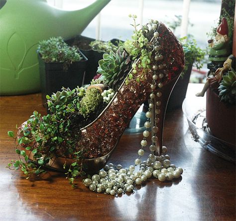 shoe planters, miniature gardens, fairy gardens, high heel pumps, high heel platform shoes, flowers, copper sequins, red patent leather, sequin shoes High Heel Decorations Ideas, Outside Ideas, Shoe Planter, Shoes Flowers, Recycled Shoes, Sequin Shoes, Miniature Gardens, Shoe Crafts, Succulent Gardening