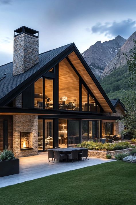 Modern mountain farmhouse with stone and glass facade. Embark on a whimsical journey through the rustic charms and untamed beauty of mountain farmhouses where heartwarming coziness meets high-altitude quirkiness. Timeless Lake House Exterior, Mountain Home With View, Mountainside House Plans, Most Beautiful Houses Exterior, Utah Mountain Home, Exterior Cabin Design, Mountain Barndominium Ideas, Mountain Modern Farmhouse, Farmhouse Mountain Home