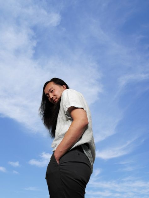 A man standing in the backdrop of blue sky with white clouds. Self Portrait Ideas Photography, Lighting Photography Ideas, Portrait Ideas Photography, Self Portrait Ideas, Outdoor Lighting Ideas, Lighting Photo, Lighting Photography, Outdoor Portrait, Low Angle