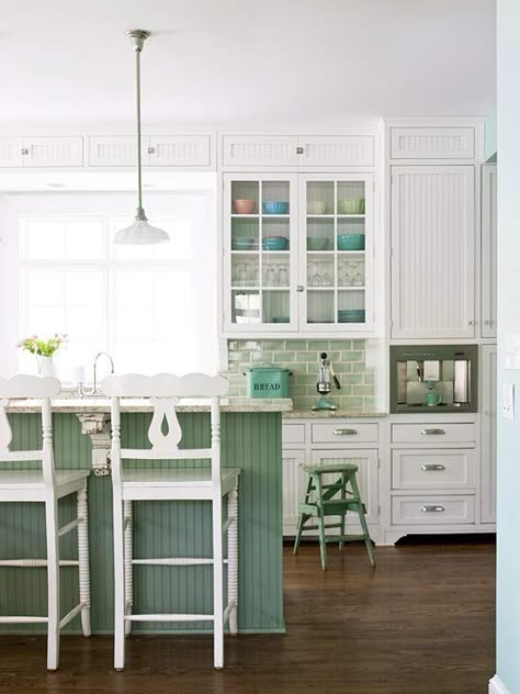 This kitchen's seaside green accents give it a light and airy feel. Painted Kitchen Island, Green Kitchen Designs, Green Backsplash, Cottage Style Kitchen, Style Cottage, Dream Kitchens, Kitchen Paint, Farmhouse Sink, Cottage Kitchen