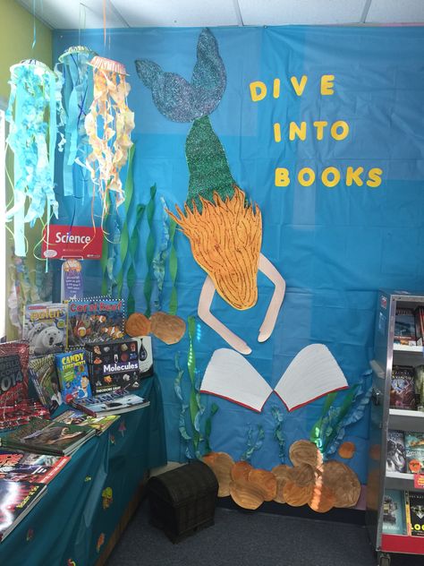 Under The Sea Book Fair Ideas, Under The Sea Book Corner, Ocean Themed Hallway Decorations, Under The Sea Reading Corner, Library Ocean Theme, Book Fair Themes Library Displays, Under The Sea Library Theme, Under The Sea School Decorations, Under The Sea Classroom Ideas