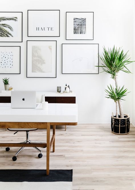 Hella Design Studio | Minimal & Feminine Office | Calgary Interior Design Having a gallery wall behind your desk makes for a cute focal point as you enter the room, and a Zoom background that will have folks talking. We used our clients images for the prints, and used sleek black frames with large photo mats to keep things cohesive and minimal feeling. 📷: @heymjay Video Background Home Office, Office Picture Wall Work Spaces, Home Office Pictures Wall, Minimal Office Design Studio Spaces, Office For Zoom Background, Cute Office Backgrounds, Zoom Background Office Space, Best Office Background, Home Office Design Background