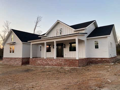 White Farmhouse Red Brick, White Home With Red Brick, Red Brick White Siding Exterior, Farmhouse Exterior Red Brick, Red Brick White Board And Batten, Red Brick Skirting House, White Vinyl Siding House With Brick, White House With Red Brick Skirting, White And Red Brick House