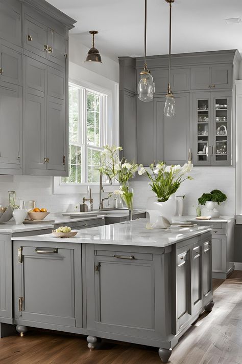 An elegant gray kitchen featuring plentiful cabinet space, a large farmhouse sink, and abundant natural light from the expansive window. Grey And White Kitchen Cabinets Modern, Stone Grey Kitchen Cabinets, Gray And Gold Kitchen, Grey Cabinet Kitchen, Kitchens With Gray Cabinets, Gray Stained Kitchen Cabinets, Grey And White Kitchen Cabinets, Light Gray Kitchen Cabinets, Warm Grey Kitchen