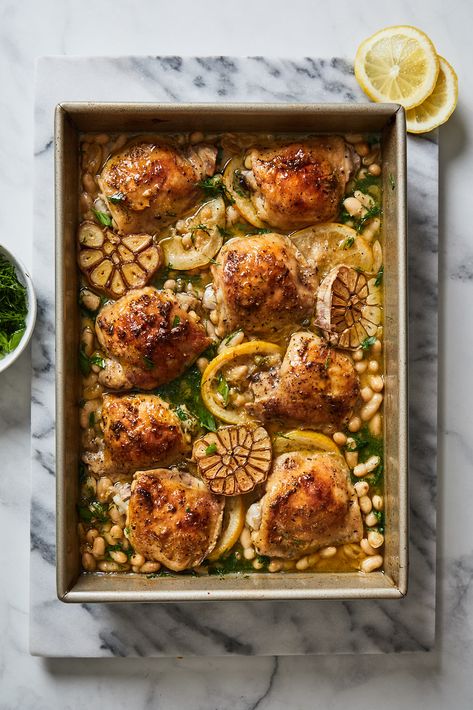 Roasted Chicken With White Beans and 20 Cloves of Garlic | Olive  Mango Chicken With White Beans, Lemon And Garlic Chicken, Spring Dishes, Classic French Dishes, French Dishes, Mango Recipes, Butter Beans, Classic Dishes, Food Magazine